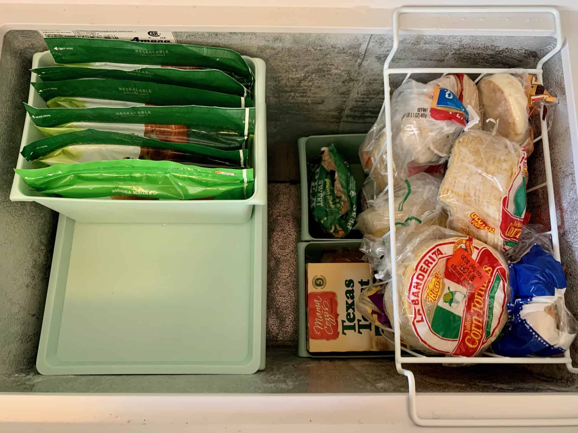 How to organize your chest freezer with baskets and dividers. Deep freezer organization tips and tricks on a budget!