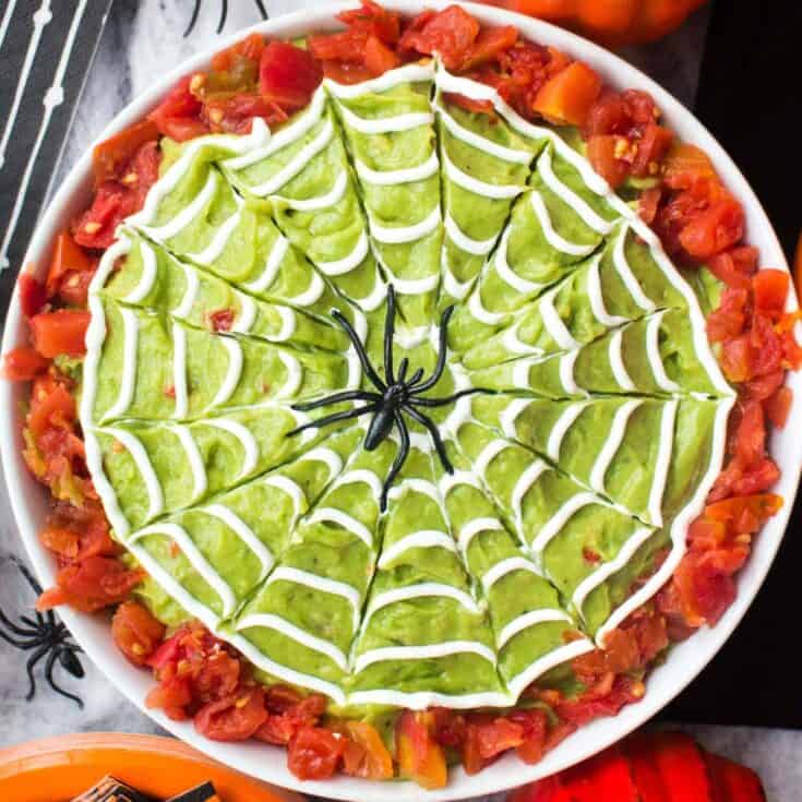 Image for Halloween Guacamole with Sour Cream Spiderwebs